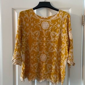 Gold embroidered blouse.